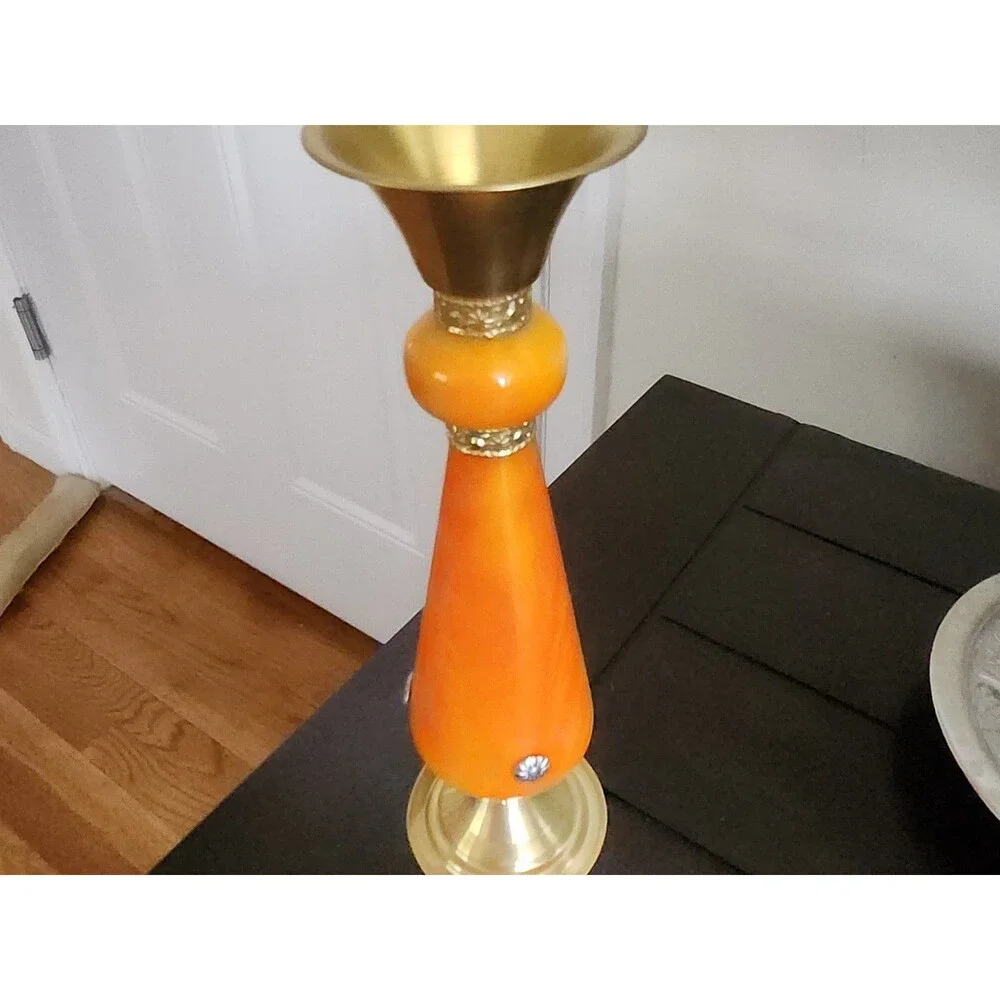 2 A brass candle holder